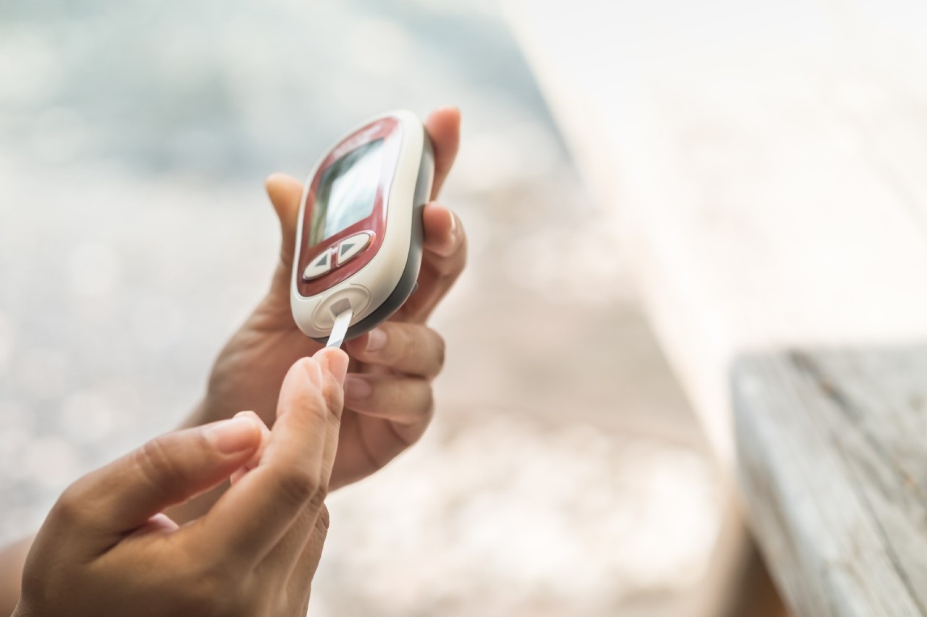 Person with diabetes testing blood sugar. 