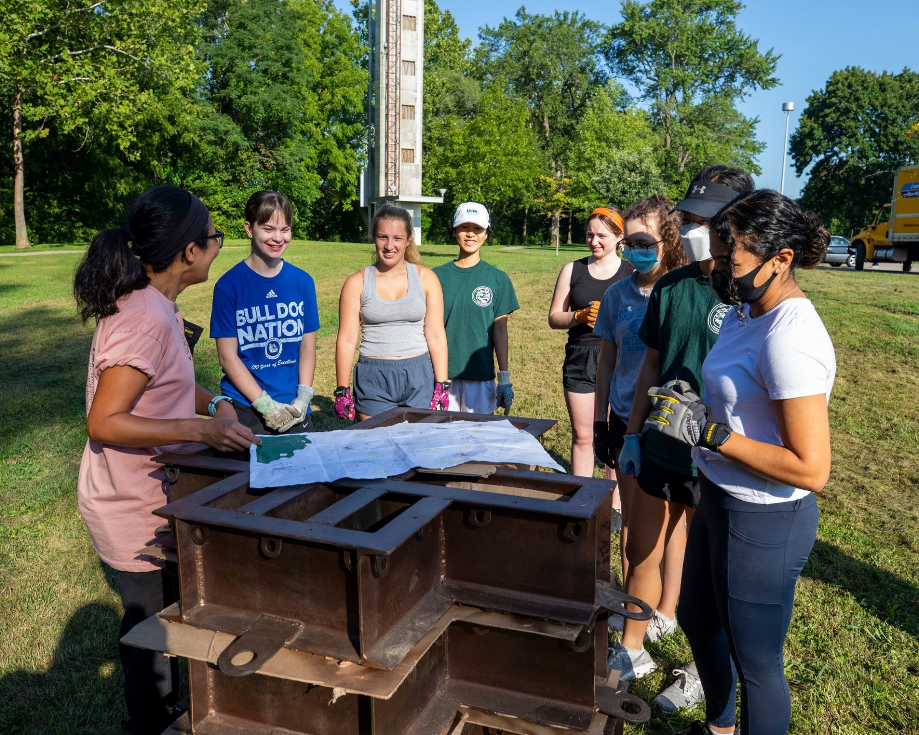 Zoom image: A team of student volunteers from the environmental club at Columbus North High School in Indiana helped UB architecture professor Joyce Hwang (far left) assemble the base structures for To Middle Species, With Love. Photo: Hadley Fruits 