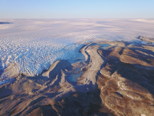Zoom image: The edge of the Greenland Ice Sheet. For a decade, glaciologist Sophie Nowicki has played a lead role in coordinating international efforts to understand how climate change is impacting the Greenland and Antarctic ice sheets. Credit: Jason Briner 