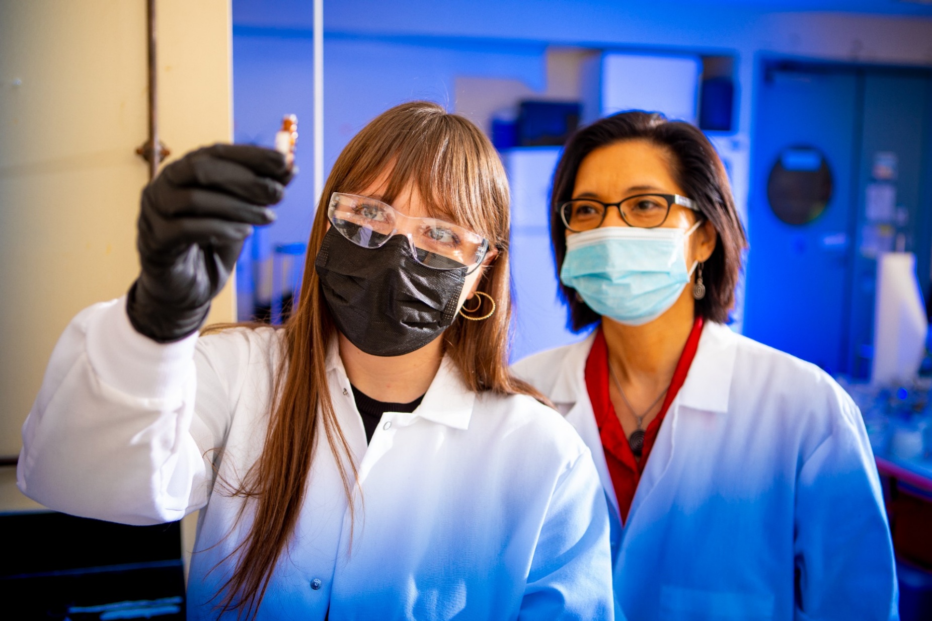 Zoom image: From left: UB chemistry PhD candidate Rebecca Dickman (left) in the lab with UB chemistry professor and UB RENEW Institute Director Diana Aga. Dickman is among scientists in the Aga lab who are conducting research related to improving the analysis of PFAS, especially the identification of emerging PFAS. Credit: Douglas Levere / University at Buffalo 