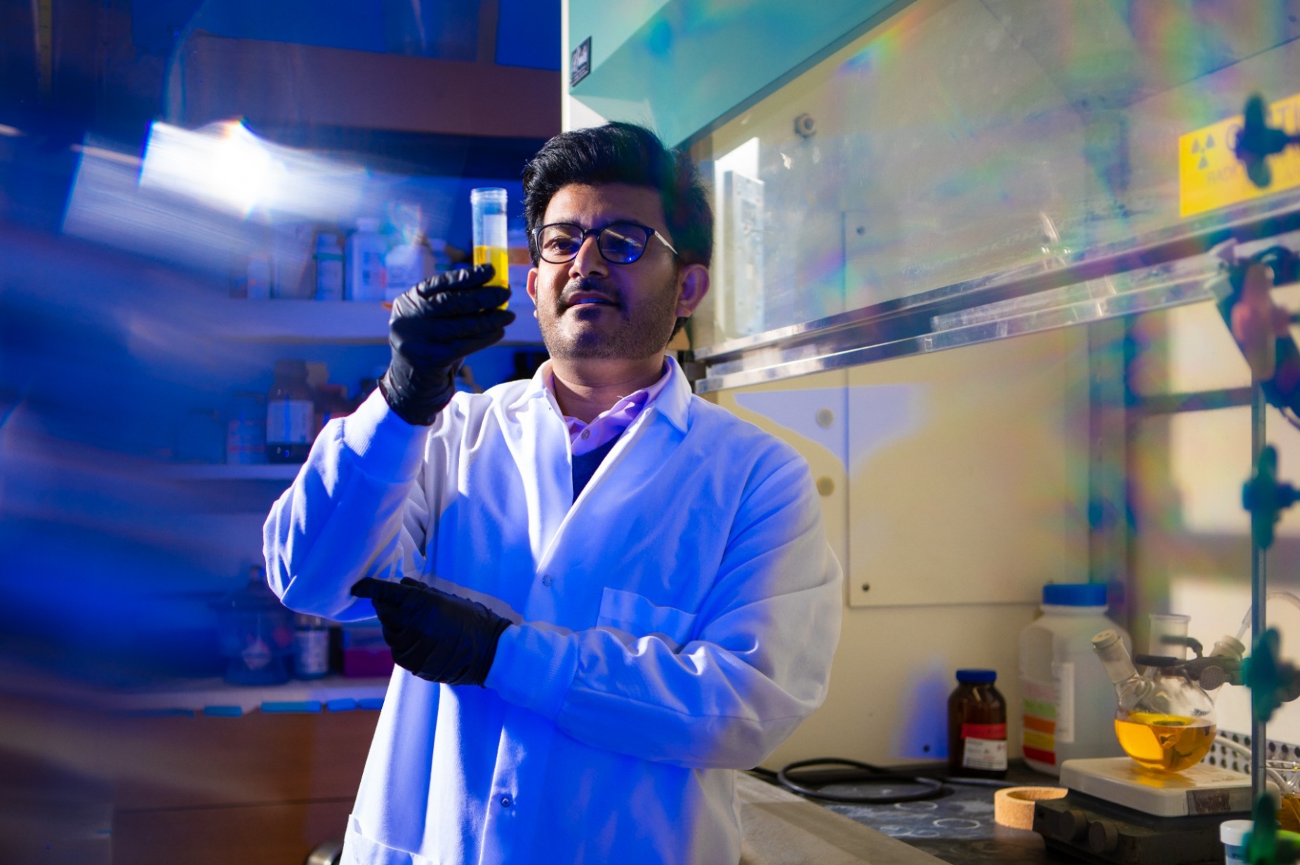 Zoom image: Utsav Thapa, UB chemistry postdoctoral research associate, works in the lab. He is a team member on a National Institutes of Health-funded project that seeks to use nanomaterials and microbes to degrade PFAS. Major goals include using advanced mass spectrometry and computer modeling to understand the degradation process and identify the byproducts left behind. Credit: Douglas Levere / University at Buffalo 