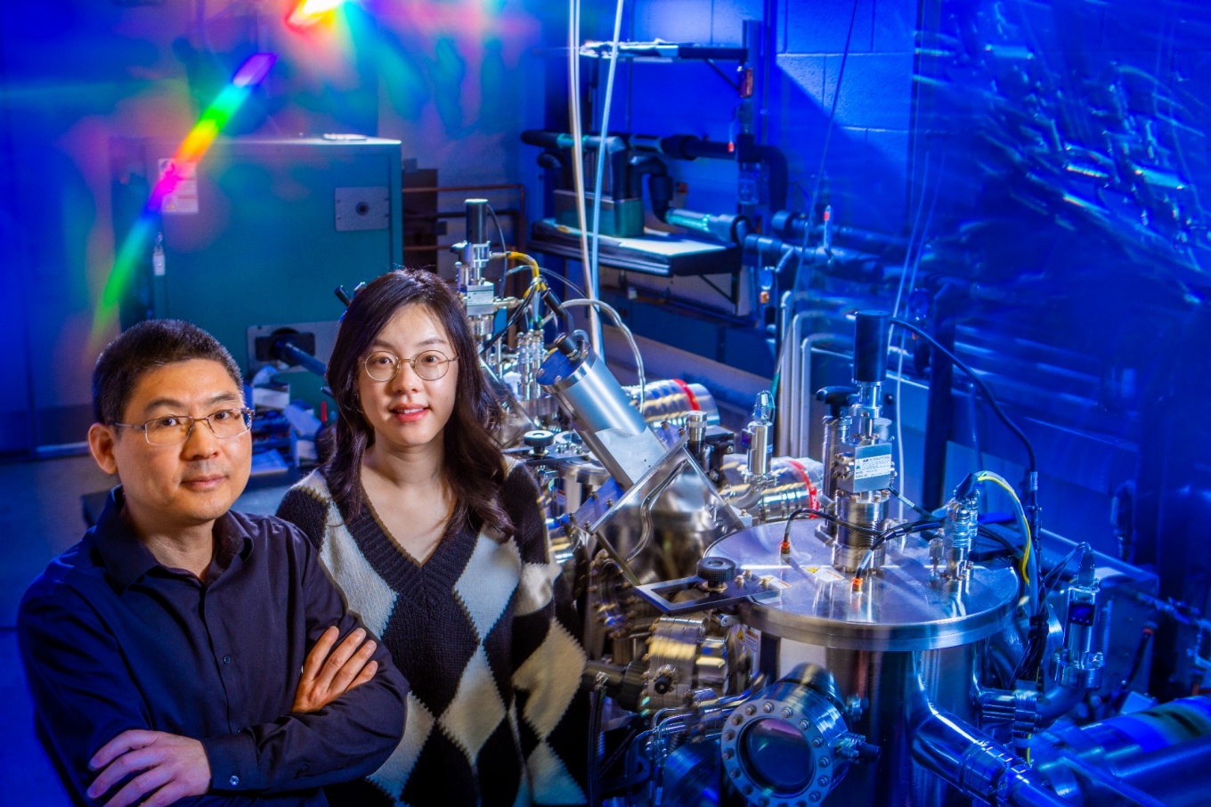 Zoom image: Hao Zeng (left), UB professor of physics, with Mengying Bian, UB physics postdoctoral researcher. Credit: Douglas Levere / University at Buffalo 