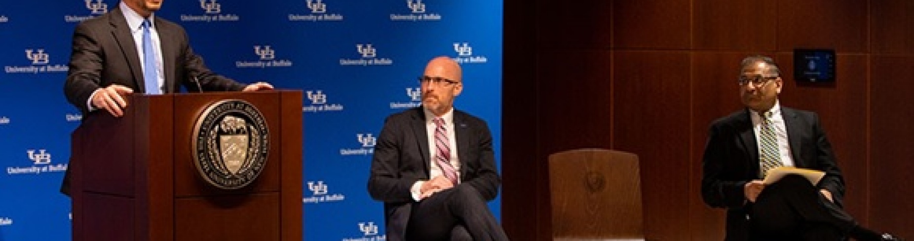 DEC Commissioner Basil Segoss (left), SUNY Distinguished Professor Amit Goyal and Kemper Lewis (far right), dean of the School of Engineering and Applied Sciences, unveil an oversized check for the $4.5 million grant to create a center for recycling research and innovation at UB.
