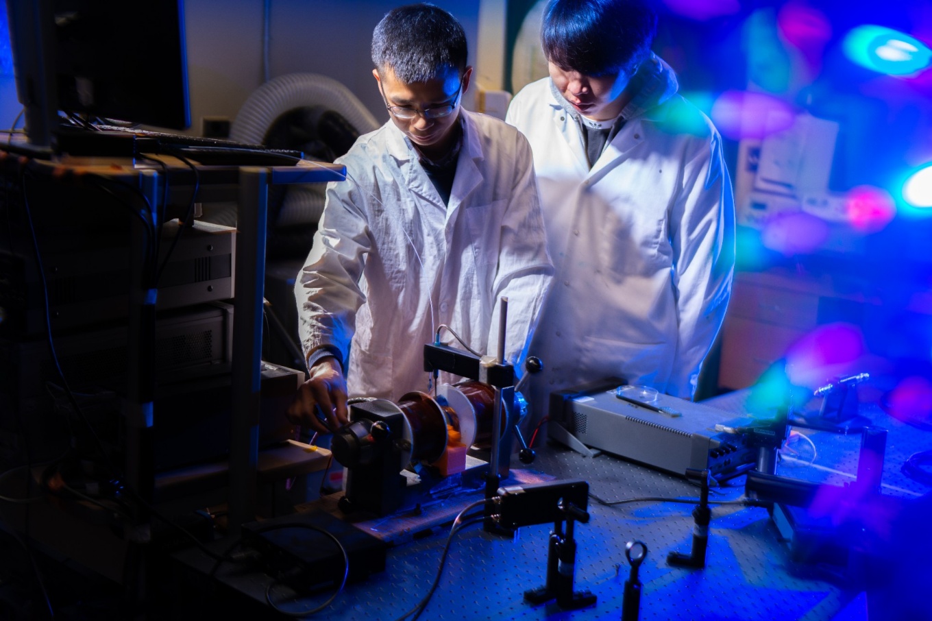 Zoom image: From left: Yulong Huang and Zheng Li, both UB postdoctoral researchers in mechanical and aerospace engineering, are among authors of a new study on magneto-ionics. Credit: Douglas Levere / University at Buffalo 