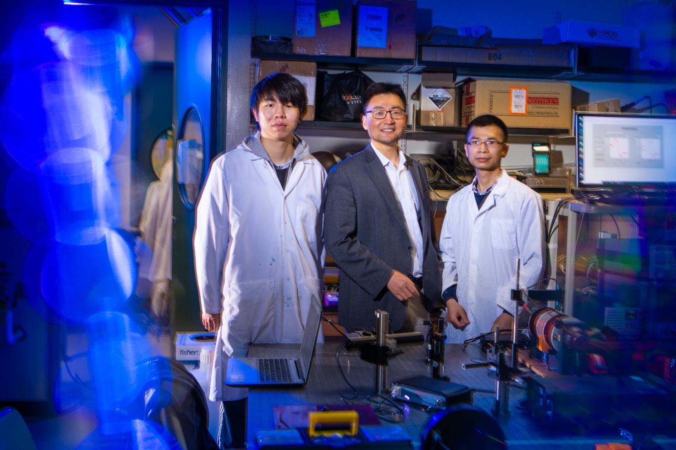 Zoom image: Shenqiang Ren (center), UB researcher in the Department of Mechanical and Aerospace Engineering, Department of Chemistry and RENEW Institute, led a new study on magneto-ionics. Zheng Li (left) and Yulong Huang (right), postdoctoral researchers in mechanical and aerospace engineering, are among the co-authors. Credit: Douglas Levere / University at Buffalo 