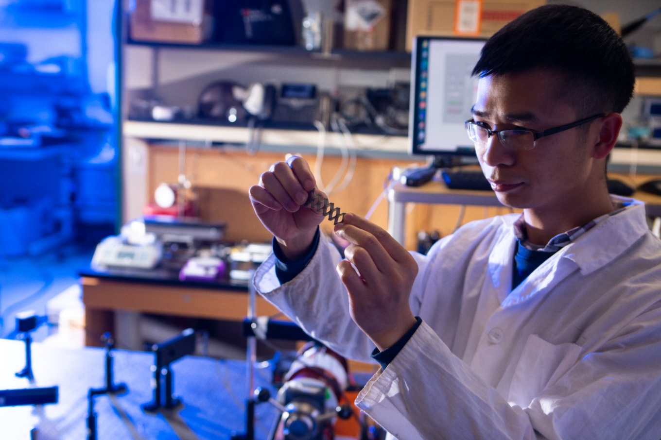 Zoom image: Yulong Huang, UB postdoctoral researcher in mechanical and aerospace engineering, holds a 3D-printed structure containing the magneto-ionic material used in a new study. The ability to print the material in varied shapes could facilitate different applications, scientists say. Credit: Douglas Levere / University at Buffalo 