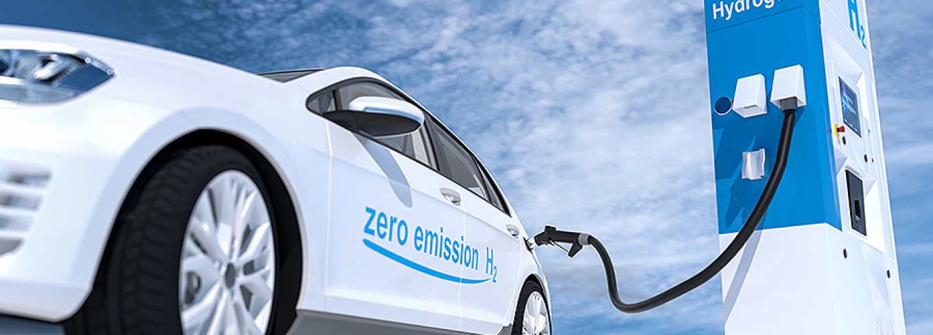 Illustration of a car plugged into a hydrogen fuel station. 