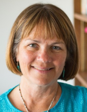 Photo of Kari Winter, Professor of American Studies in UB's College of Arts and Sciences, in her office. 