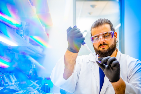 Zoom image: Petar Pajic, UB PhD student in biological sciences, prepares a saliva sample for separation and analysis. Credit: Douglas Levere / University at Buffalo 