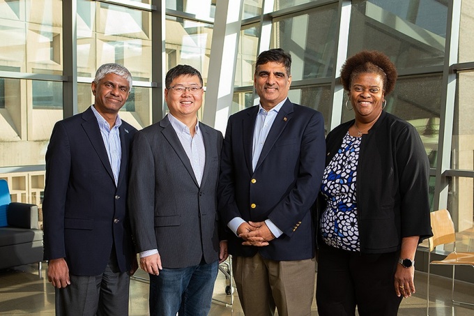Members of the AI Institute for Exceptional Education team. From left: Ranga Setlur, Jinjun Xiong, Venu Govindaraju and Letitia Thomas. Photo: Douglas Levere. 