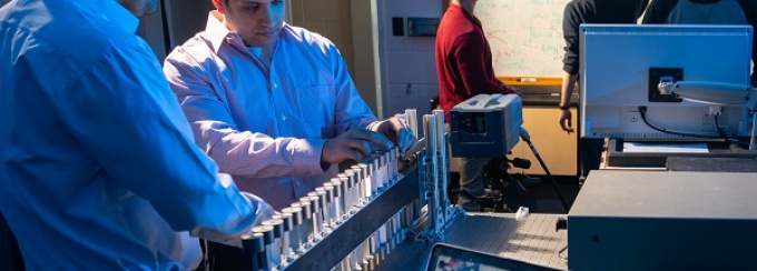 Mostafa Nouh working in his acoustics lab with students. 