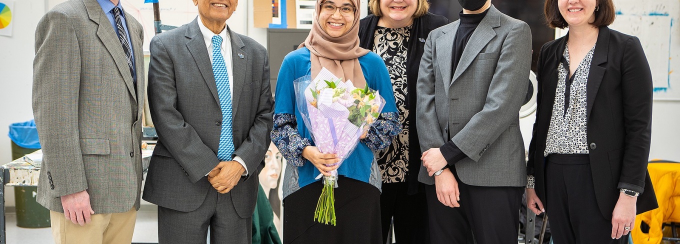 From left: Peter Pfordresher, President Satish K. Tripathi, Jean Wactawski-Wende, H Fogarty and Megan Stewart surprised Samiha Islam (center) with the news that she had been awarded the prestigious Truman scholarship. Photo: Douglas Levere.