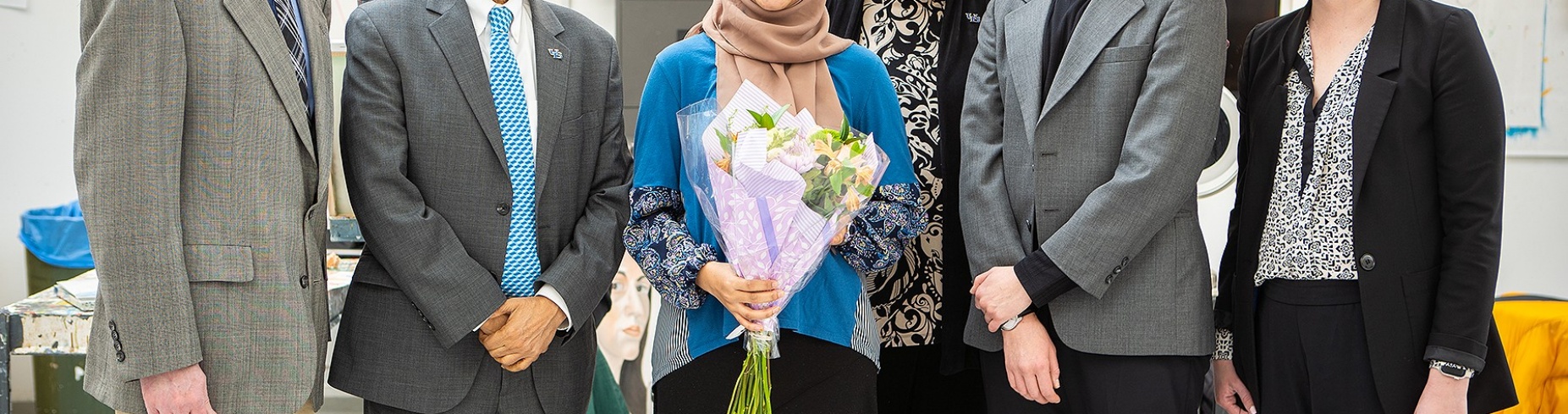 From left: Peter Pfordresher, President Satish K. Tripathi, Jean Wactawski-Wende, H Fogarty and Megan Stewart surprised Samiha Islam (center) with the news that she had been awarded the prestigious Truman scholarship. Photo: Douglas Levere. 