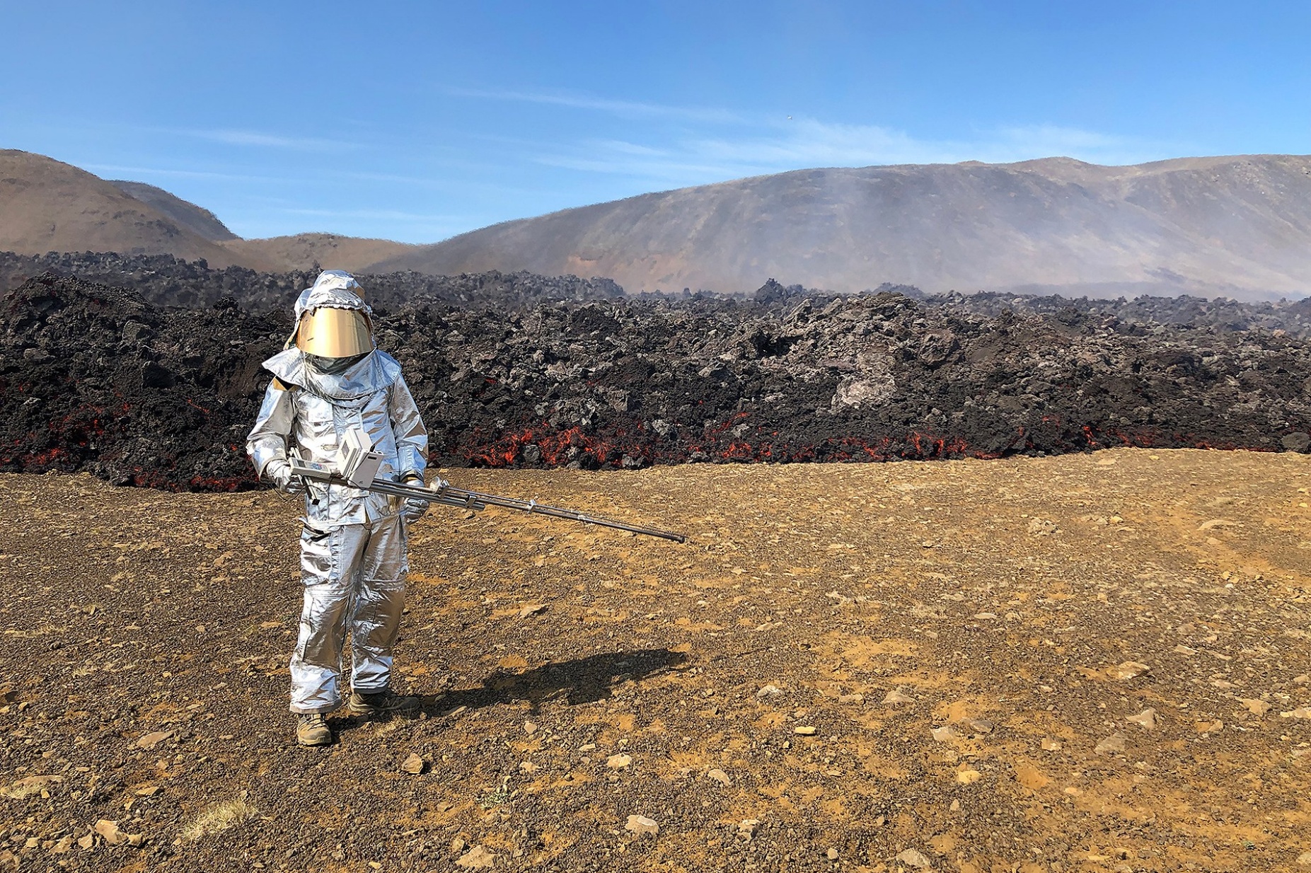 Martin Harris, a PhD student in the lab of UB geology assistant professor Stephan Kolzenburg, with a field rheometer prototype to measure flow properties of lava at Litli-hr&uacute;tur in Iceland. 