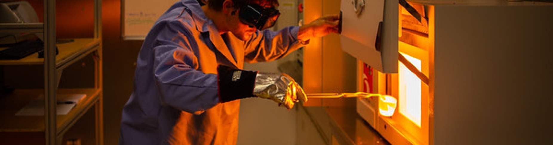 Stephan Kolzenburg in his lab placing a very hot piece magma in an oven. 