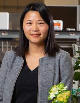 Zhen Wang portrait in a lab. 