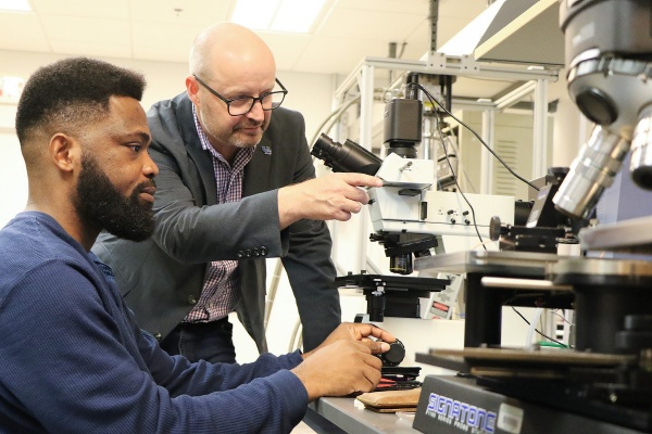 Zoom image: Ian Sellers, professor of electrical engineering, works with PhD student David Shaibu in the lab. Photo: Peter Murphy 