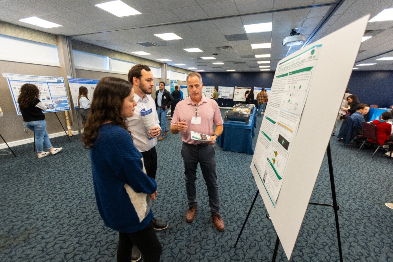 Zoom image: The Workshop on Emerging HRMS and LC-MS/MS Applications in Environmental Analysis and Food Safety allowed scientists from across the globe to share their analytical chemistry research, including with a poster session in the UB Center for Tomorrow. Photo: Douglas Levere/University at Buffalo 