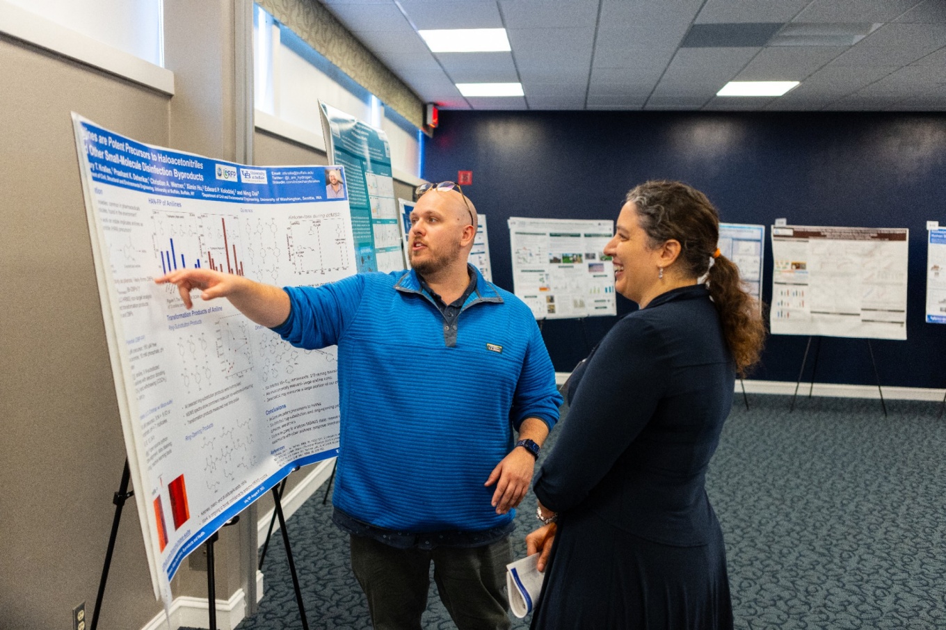 Zoom image: Zachary Kralles, an electrical engineering PhD student, shows off his research poster. Photo: Douglas Levere/University at Buffalo 