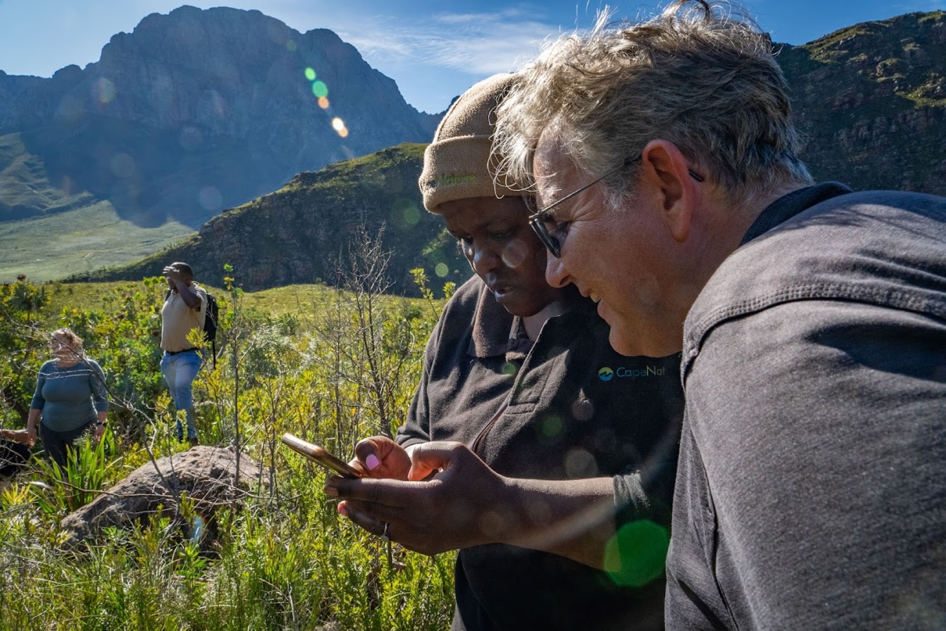 Zoom image: BioSCape team members are also conducting field work, including measuring plants&rsquo; spectral reflectance, recording bird and insect calls, and extracting environmental DNA from water samples. Photo: Jeremy Shelton 