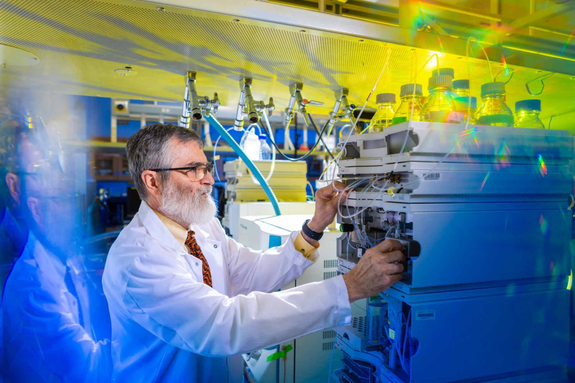 Zoom image: University at Buffalo chemist Luis Col&oacute;n works in his lab in UB's Natural Sciences Complex. Colon is the principal investigator on a National Science Foundation grant to develop adsorbent materials for detecting forever chemicals. Credit: Douglas Levere/University at Buffalo 