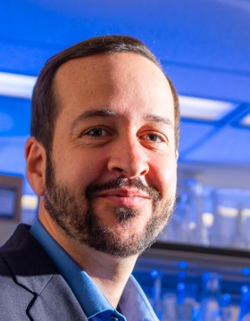 Jon Lovell head shot, in a lab. 