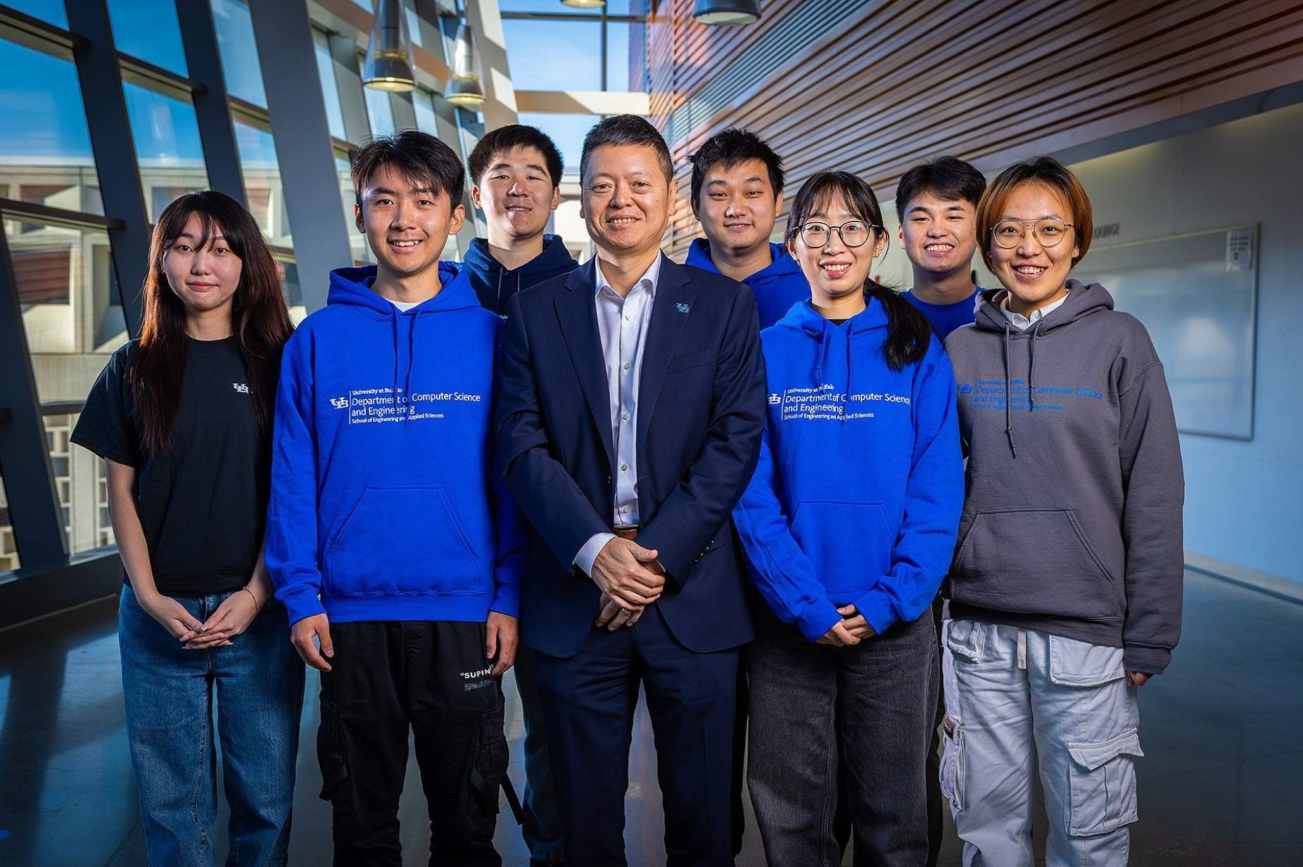 Zoom image: Siwei Lyu (third from right), Shan Jai (second from right) and the rest of UB Media Forensic Lab asked ChatGPT and other large language models to anaylze deepfake images of human faces. Photo: Douglas Levere/University at Buffalo 
