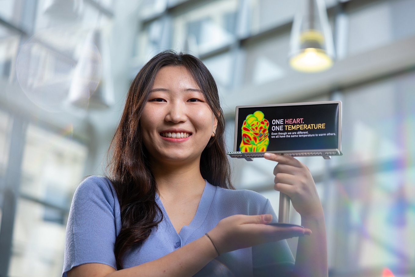 Zoom image: Haeun Lee won a billboard design competition conducted through the UB Curriculum course &ldquo;American Diversity and Design.&rdquo; Photo: Douglas Levere 