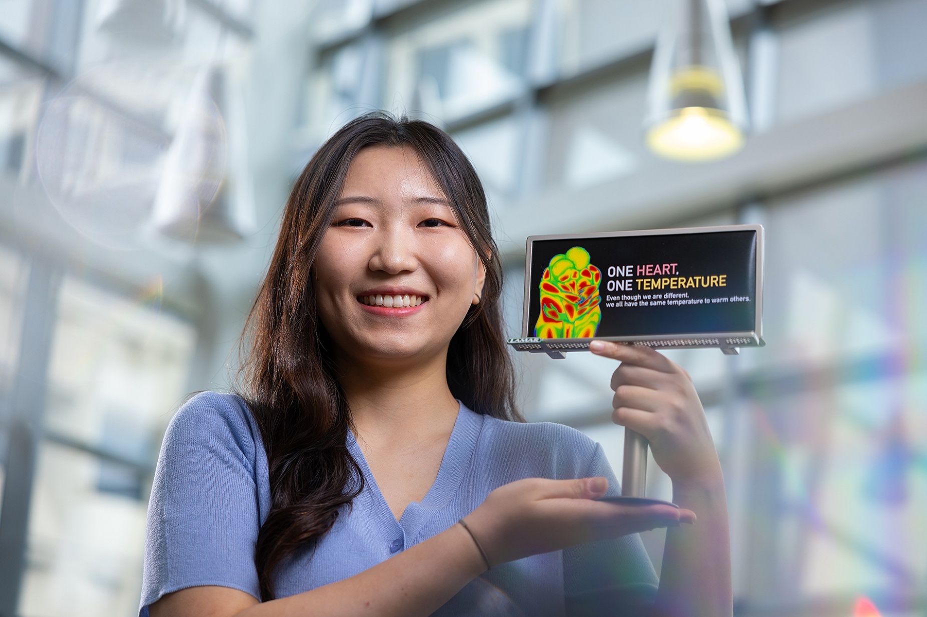 Zoom image: Haeun Lee won a billboard design competition conducted through the UB Curriculum course &ldquo;American Diversity and Design.&rdquo; Photo: Douglas Levere 