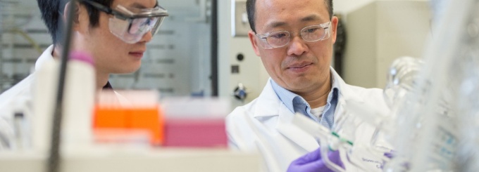 Haiqing Lin, right, and a student in his lab. 