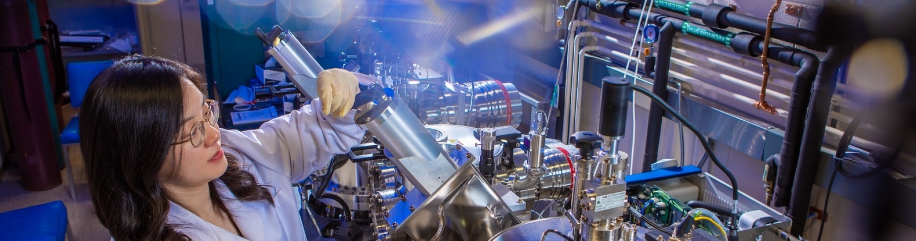 UB scientist uses the dual chamber thin film deposition system to conduct advanced semiconductor research. Credit: Douglas Levere / University at Buffalo.