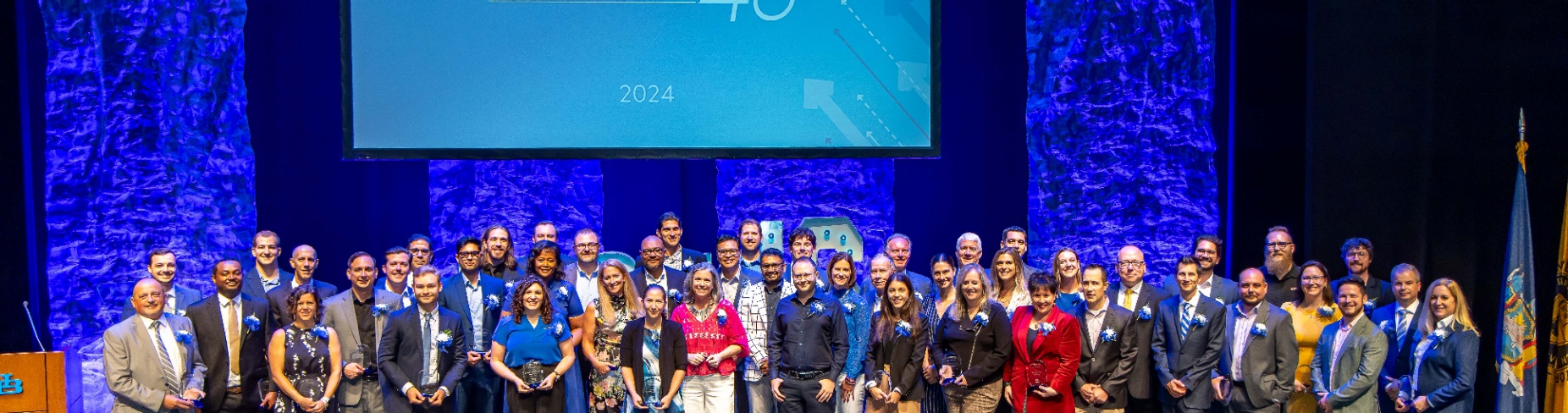 Overhead group shot of roughly 70 Fast 46 participants.