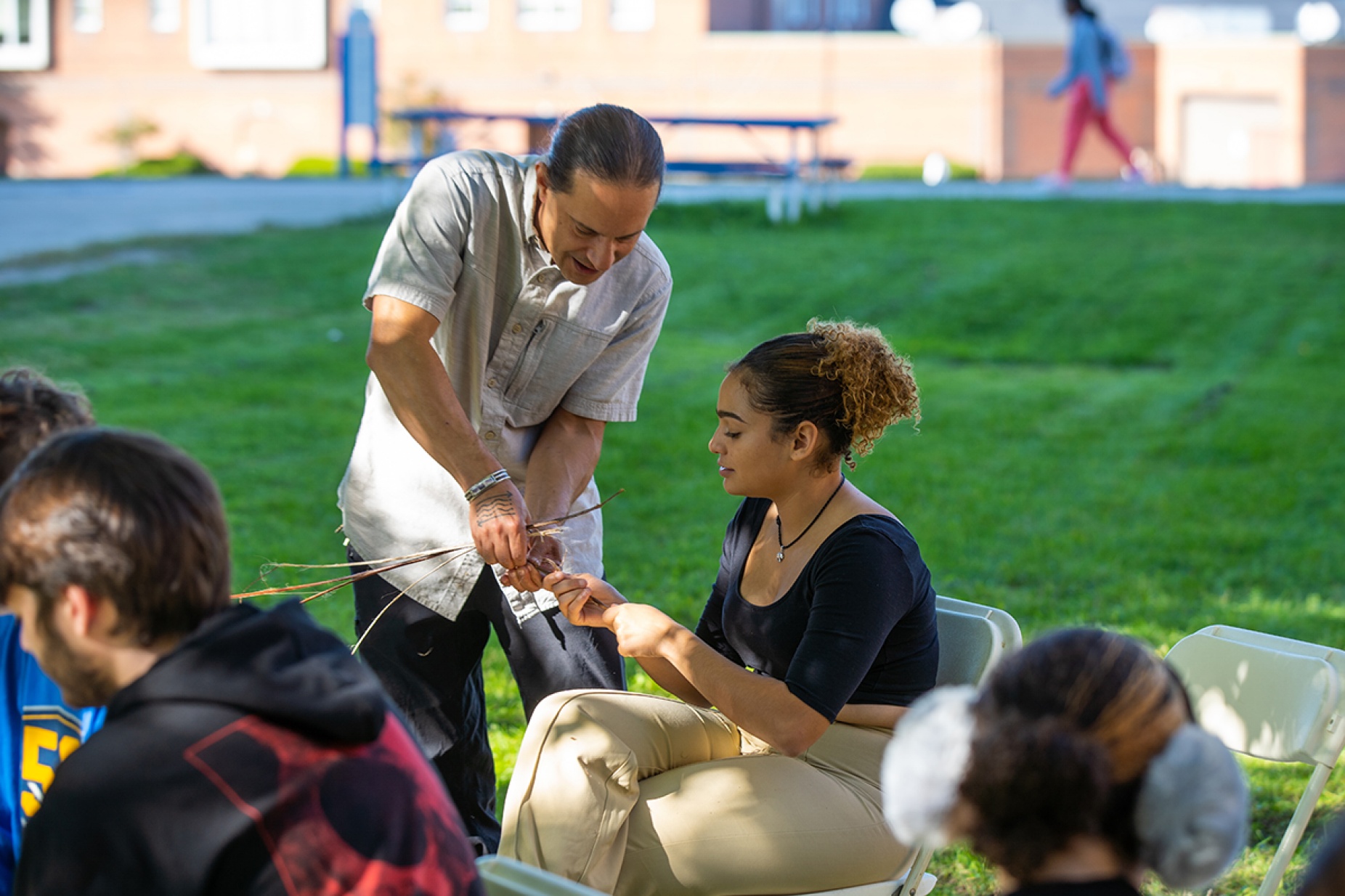 Zoom image: Jason Corwin (Seneca Nation, Deer Clan), clinical assistant professor in the UB Department of Indigenous Studies, teaching his introduction to land-based learning class.&nbsp;Photo: Douglas Levere 