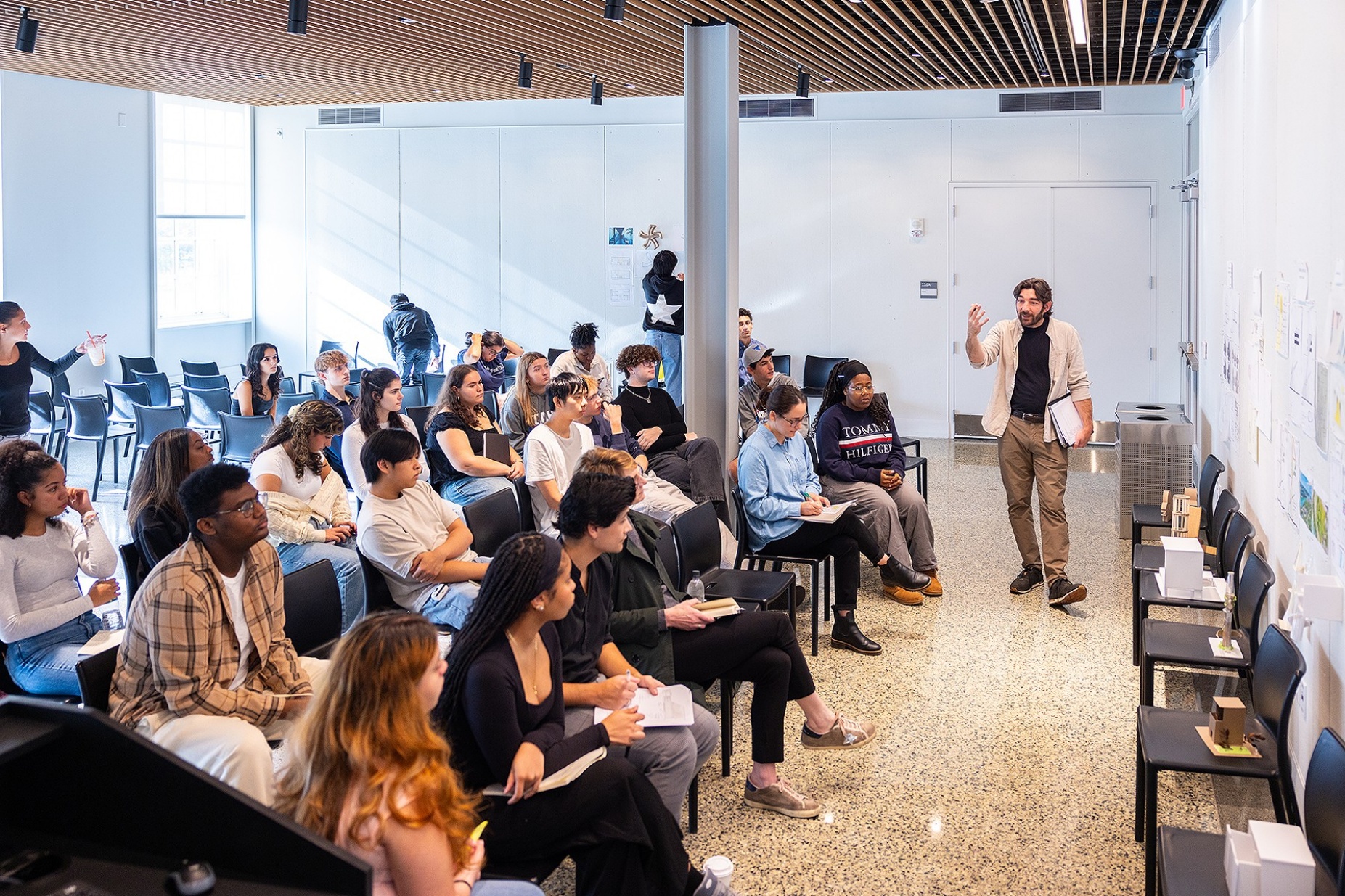 Zoom image: Jon Spielman, adjunct instructor in the Department of Architecture, leads a section of ARC 101, the first-year architecture studio. For the first time at UB, the studio has enrolled more women than men, a trend in line with what's happening at other architecture schools across the country. Photo: Douglas Levere 