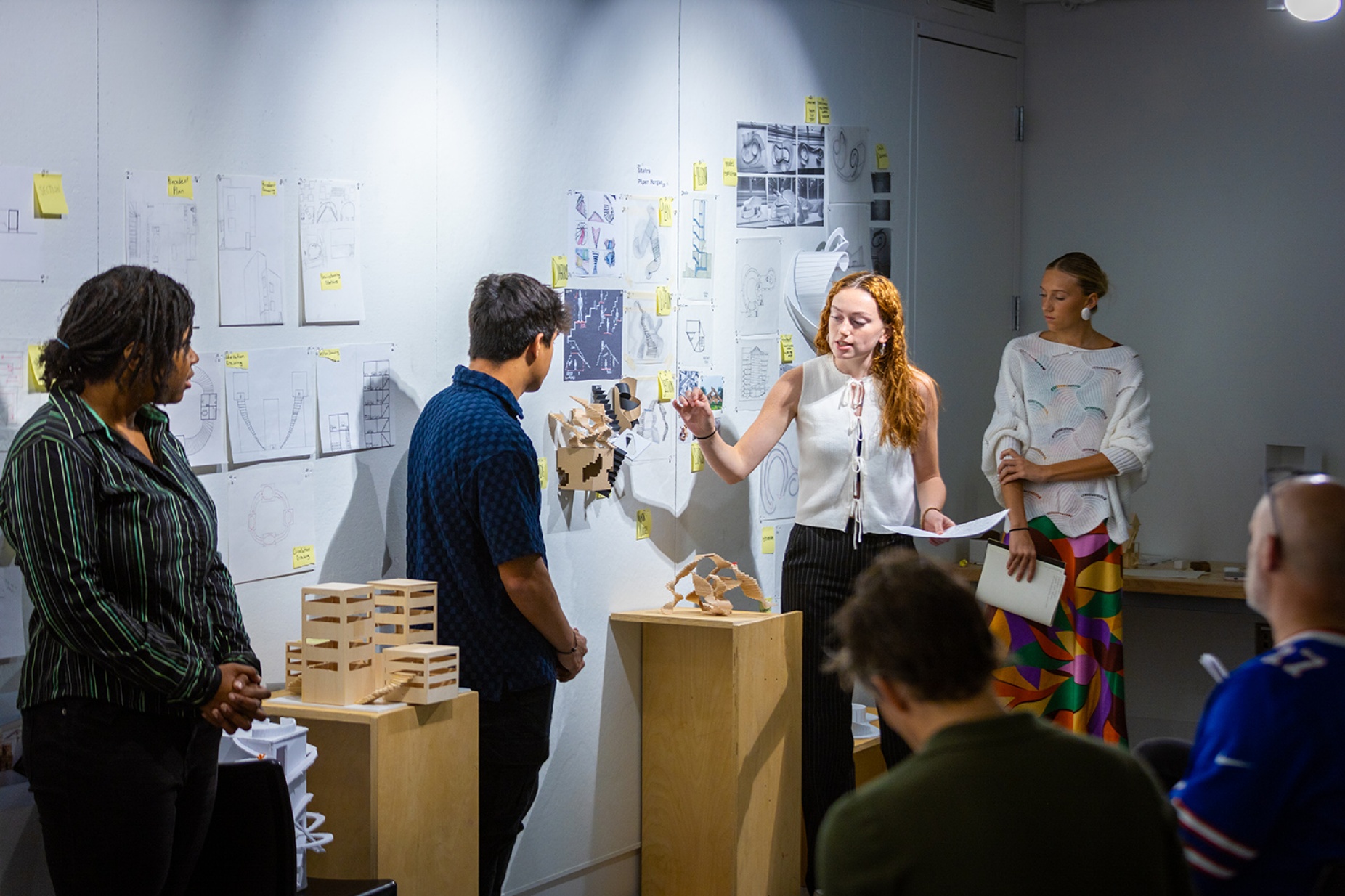 Zoom image: Piper Morgan (second from right) presents a project during ARC 101, the first-year studio that serves as the entry point for the architecture program. Photo: Douglas Levere 