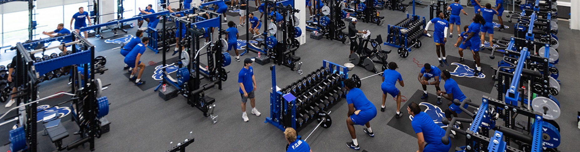 Zoom image: The UB Bulls football team works out inside the new Brittany Murchie Mulla Sports Performance Center. Photo: Douglas Levere 