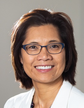 A portrait of Diana Aga, of the department of chemistry and the RENEW Institute, taken in April 2023 in the Natural Sciences Complex. Photographer: Meredith Forrest Kulwicki. 