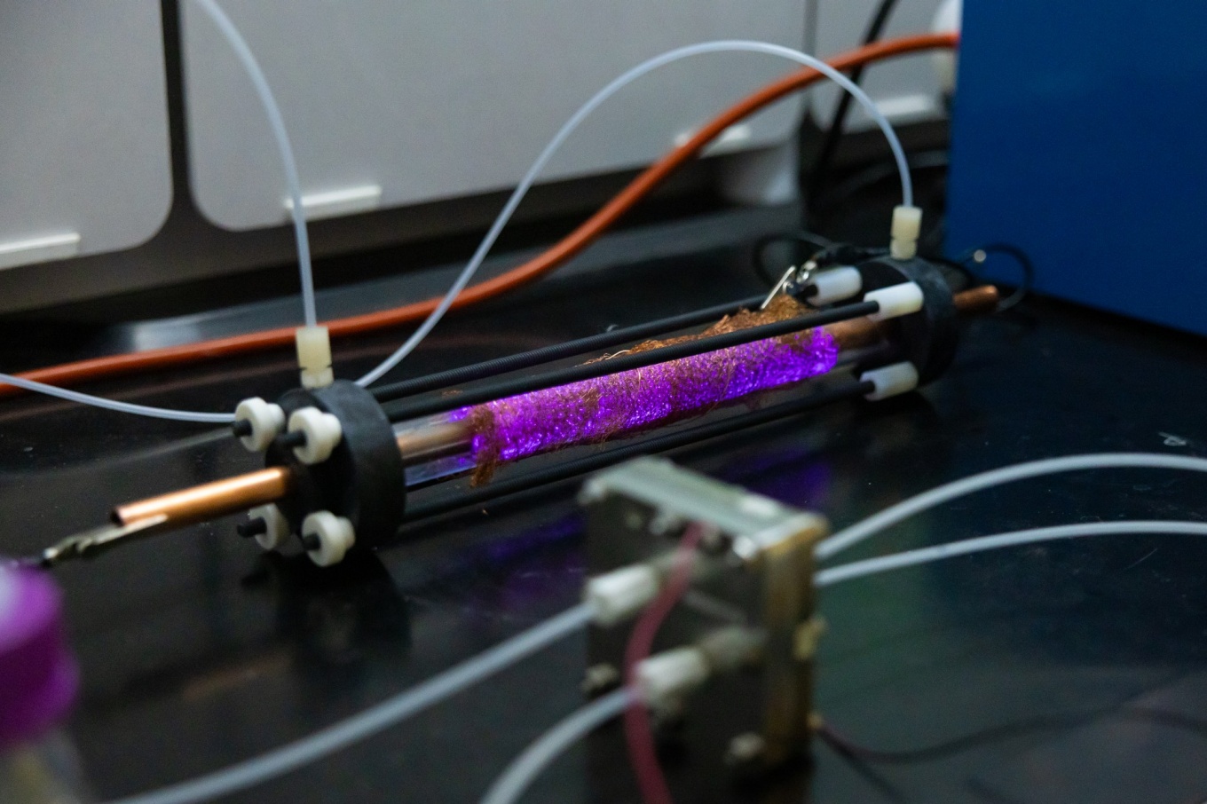 Zoom image: A plasma-electrochemical reactor developed by the team of Chris Li can convert nitrogren in the air into ammonia without a carbon footprint. Photo: Douglas Levere/University at Buffalo 