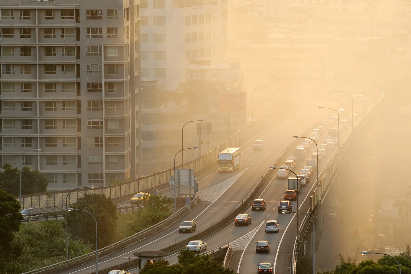 A metropolitan freeway with smog in the air. 