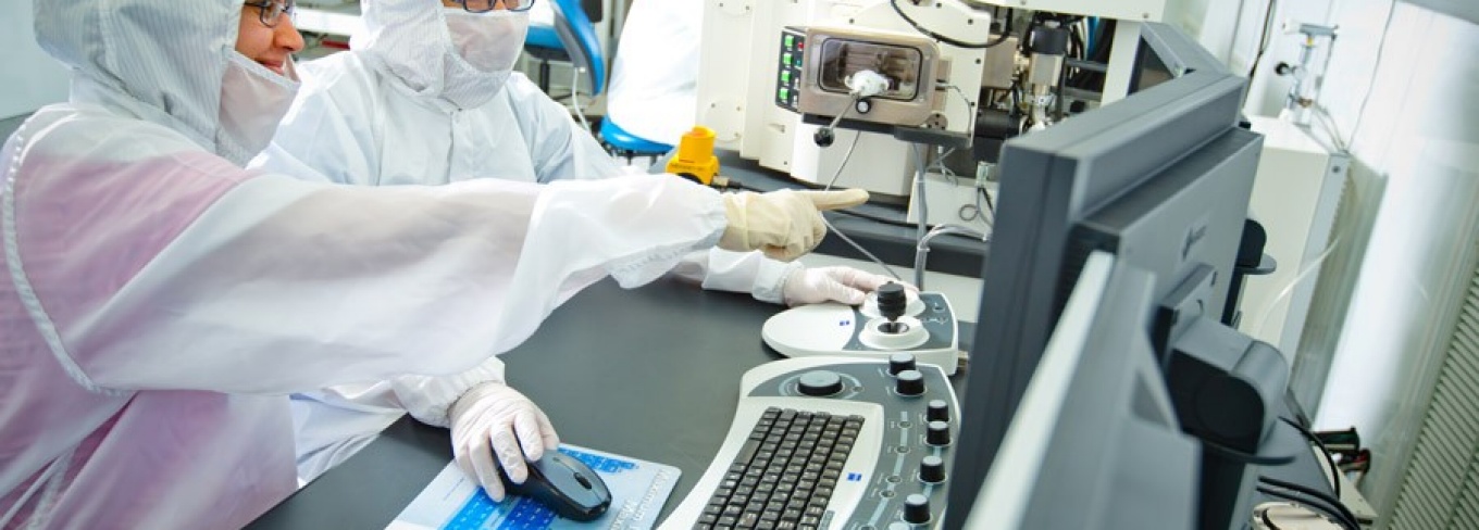 Researchers work inside the clean room at Davis Hall. 