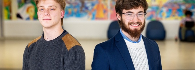 Nicholas Reilly (left), a junior majoring in chemical engineering, and Nicholas Pratt, a junior majoring in bioinformatics and computational biology, stand together in a UB hallway. 
