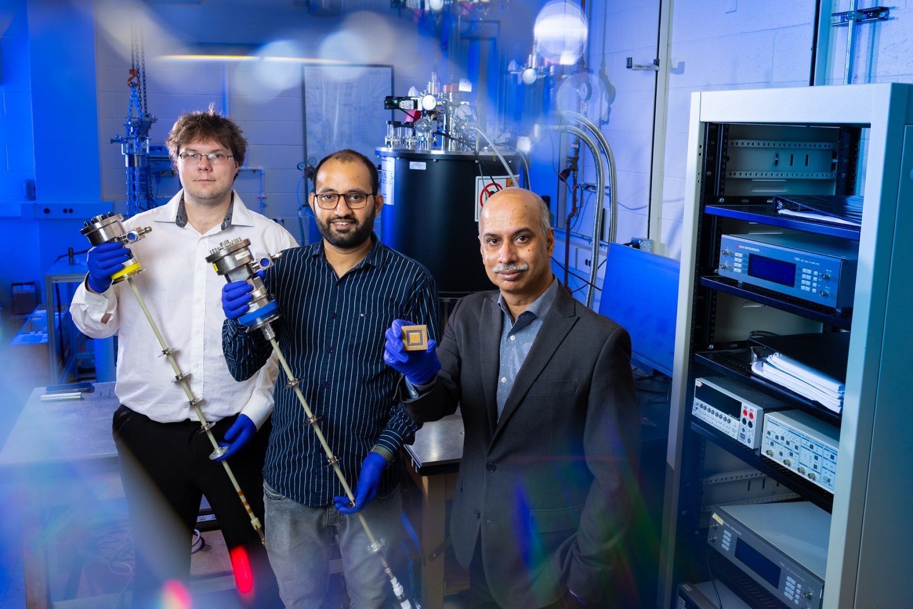 Zoom image: Ganapathy's team includes graduate students Nicholas Jerla (left) and Nitin Kumar (center). Photo: Douglas Levere/University at Buffalo 