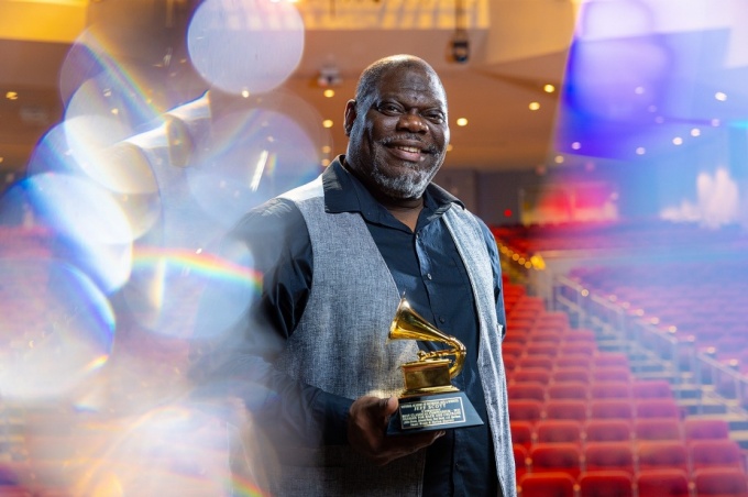 Zoom image: UB music professors Jeffrey Scott, with the Grammy he received for composing &ldquo;Passion for Bach and Coltrane.&rdquo; Photo: Douglas Levere/University at Buffalo. 