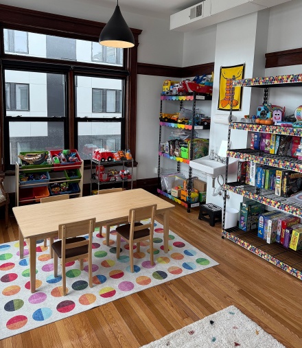 A bright and cheery toy library.