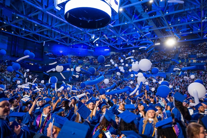 Graduating students celebrate at Alumni Arena.
