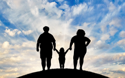 Concept of a bright future for a family struggling with obesity featuring silhouettes of three family members standing on a hill with a bright blue sky in the background.. 