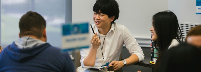 Past particpants of UB&rsquo;s Sophomore Externship Experience (SEE) have a discussion inside a classroom. 