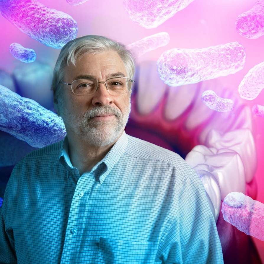 Frank Scannapieco pictured with teeth and bacteria in the background. 