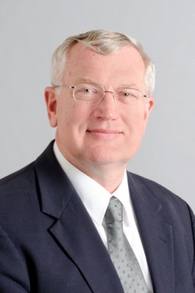 John E. Tomaszewski. 