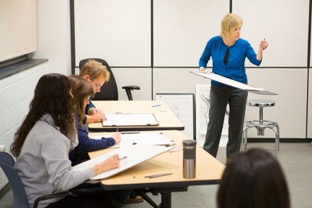 Medical students sketch a model in the "Life Drawing" workshop led by Ginny O'Brien, curator of education at the UB Anderson Gallery. Photo: Douglas Levere. 